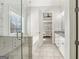 Modern bathroom featuring a glass-enclosed shower, soaking tub, and granite countertop vanity at 266 Hanover Dr, Villa Rica, GA 30180