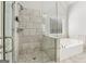 Modern bathroom with a glass enclosed shower and separate soaking tub at 266 Hanover Dr, Villa Rica, GA 30180