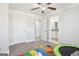 Bedroom with carpet, ceiling fan, and open doorway to bathroom at 266 Hanover Dr, Villa Rica, GA 30180