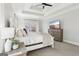Bright bedroom with a tray ceiling, large windows, and a cozy bed at 266 Hanover Dr, Villa Rica, GA 30180
