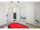 Cozy bedroom featuring carpet, white trim and doors, and view to bathroom and closet at 266 Hanover Dr, Villa Rica, GA 30180