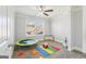 Bedroom with carpet, ceiling fan, and window to let in natural light at 266 Hanover Dr, Villa Rica, GA 30180
