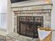 Elegant stone fireplace with a decorative screen and a cozy ambiance at 266 Hanover Dr, Villa Rica, GA 30180