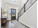 Bright foyer featuring hardwood floors, staircase with wrought iron, and natural light at 266 Hanover Dr, Villa Rica, GA 30180