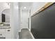 Charming hallway features a vanity with granite countertops and a stylish accent wall at 266 Hanover Dr, Villa Rica, GA 30180