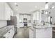 Modern kitchen with white cabinets, granite countertops, stainless steel appliances and open layout at 266 Hanover Dr, Villa Rica, GA 30180