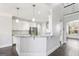 Open concept kitchen with white cabinetry, granite countertops and stainless steel appliances at 266 Hanover Dr, Villa Rica, GA 30180