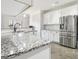 Well-equipped kitchen featuring granite countertops, stainless steel appliances, and ample cabinet space at 266 Hanover Dr, Villa Rica, GA 30180