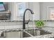 Close up of kitchen sink with granite countertops and modern faucet at 266 Hanover Dr, Villa Rica, GA 30180