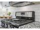 Modern black stainless steel gas cooktop and range with subway tile backsplash at 266 Hanover Dr, Villa Rica, GA 30180