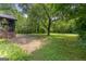 A sprawling, private backyard with a brick patio provides a serene outdoor retreat at 955 Landmark Dr, Sandy Springs, GA 30342
