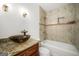 Modern bathroom with a sleek vanity, stylish sink, and a beautifully tiled shower/tub combination at 955 Landmark Dr, Sandy Springs, GA 30342