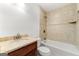 Bright bathroom featuring a granite vanity top, neutral tiling, and a soaking tub with shower at 955 Landmark Dr, Sandy Springs, GA 30342