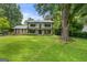 Stunning two-story home with a beautiful lawn and mature trees at 955 Landmark Dr, Sandy Springs, GA 30342