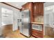 Modern kitchen featuring a stainless steel refrigerator and wooden cabinets at 955 Landmark Dr, Sandy Springs, GA 30342