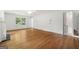 Spacious living room with hardwood floors, and filled with natural light from a large window at 955 Landmark Dr, Sandy Springs, GA 30342