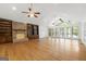 Bright living room with high ceilings, exposed brick fireplace, hardwood floors and plenty of natural light at 955 Landmark Dr, Sandy Springs, GA 30342