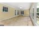 Inviting sunroom with tiled floors and ample windows, offering backyard view and lots of sunlight at 955 Landmark Dr, Sandy Springs, GA 30342