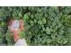 Aerial view showcases the property's location nestled amongst lush trees and surrounding greenery at 3019 Beverly Ct, Mcdonough, GA 30252