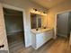 Bathroom featuring dual vanity, granite countertops, framed mirror and great natural light at 3019 Beverly Ct, Mcdonough, GA 30252