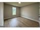Bedroom with luxury vinyl floors and neutral paint; lots of great natural light at 3019 Beverly Ct, Mcdonough, GA 30252