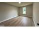 Bright, spacious bedroom with hardwood flooring and large window at 3019 Beverly Ct, Mcdonough, GA 30252