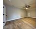 Bedroom features a ceiling fan and laminate flooring at 3019 Beverly Ct, Mcdonough, GA 30252