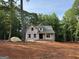 Exterior elevation shows the home under construction in a wooded lot at 3019 Beverly Ct, Mcdonough, GA 30252