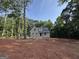 Exterior front elevation of a new brick home under construction surrounded by a treeline at 3019 Beverly Ct, Mcdonough, GA 30252
