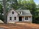 New construction home featuring covered front porch with columns in a wooded setting at 3019 Beverly Ct, Mcdonough, GA 30252