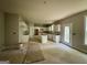 Spacious unfinished kitchen area with white cabinets and natural light coming in from the windows at 3019 Beverly Ct, Mcdonough, GA 30252