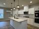 Modern kitchen featuring granite countertops, stainless steel appliances, and pendant lighting at 3019 Beverly Ct, Mcdonough, GA 30252
