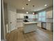Bright kitchen with granite counters, stainless appliances, white cabinetry, and island at 3019 Beverly Ct, Mcdonough, GA 30252