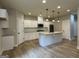 Bright, white kitchen with granite counters, stainless appliances, and a kitchen island at 3019 Beverly Ct, Mcdonough, GA 30252