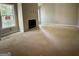 Unfinished living room showcasing a fireplace, drywall, and a bright window at 3019 Beverly Ct, Mcdonough, GA 30252