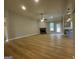 Open-concept living room with a fireplace, light colored floors, and view of the kitchen at 3019 Beverly Ct, Mcdonough, GA 30252