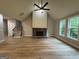 Open living room showcasing vaulted ceilings, a stone fireplace, and lots of natural light at 3019 Beverly Ct, Mcdonough, GA 30252