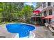 Enjoy a refreshing backyard pool, a covered bar area, and deck perfect for outdoor entertaining and relaxation at 103 Everhill, Peachtree City, GA 30269
