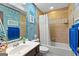 Well lit bathroom with a tub and shower, and blue themed decor at 103 Everhill, Peachtree City, GA 30269