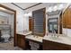 A lovely bathroom with a double sink vanity, and a view to the walk-in toilet and shower at 103 Everhill, Peachtree City, GA 30269