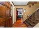 Welcoming foyer with hardwood floors and staircase at 103 Everhill, Peachtree City, GA 30269