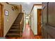 Inviting entryway showcasing gleaming hardwood floors and staircase leading to upper level at 103 Everhill, Peachtree City, GA 30269