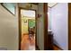 Hallway view toward the dining room and showing a powder room with a striking vessel sink at 103 Everhill, Peachtree City, GA 30269