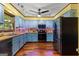 The bright eat-in kitchen features light blue cabinets, wood countertops, updated appliances, and wood flooring at 103 Everhill, Peachtree City, GA 30269