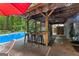 Poolside bar and lounge area for effortless relaxation and entertaining at 103 Everhill, Peachtree City, GA 30269