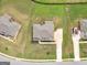 Bird's-eye view of home showing its landscaped yard, driveway, and neighborhood at 149 Elkins Blvd, Locust Grove, GA 30248