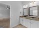Bathroom showcasing a double vanity with granite countertops and tiled floors at 149 Elkins Blvd, Locust Grove, GA 30248