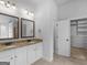 Bathroom features dual vanities with granite counters at 149 Elkins Blvd, Locust Grove, GA 30248