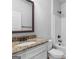 Bathroom featuring a vanity with granite countertops, white cabinets, and chrome shower fixtures at 149 Elkins Blvd, Locust Grove, GA 30248