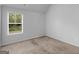 Comfortable bedroom with a window offering backyard views at 149 Elkins Blvd, Locust Grove, GA 30248